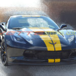 Black C7 Z06 with yellow GM full length dual racing stripes