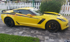 Yellow C7 Corvette Z06 with 3M 1080 gloss carbon flash supercharged Yenko style side stripes