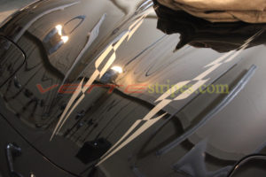 Black c5 corvette with gold super hood stripe spear