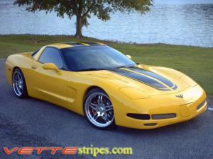 Yellow C5 Corvette coupe with black CE commemorative stripes