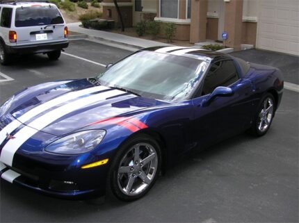 Lemans blue C6 corvette coupe with white dual racing stripes