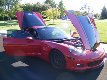 Red C6 Corvette Z06 Grand Sport with black and silver ME stripe and custom texts