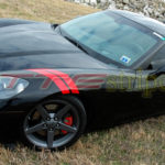 C6 Corvette black with red fender hash marks stripe