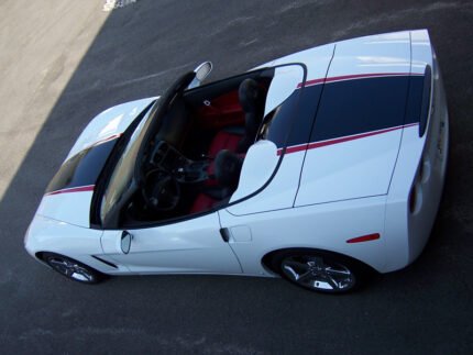 Arctic white C6 Corvette convertible with black and red ME stripes