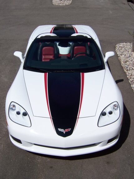 Arctic white C6 Corvette convertible with black and red ME stripes