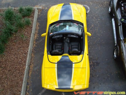 Yellow C6 Corvette convertible with black carbon fiber and silver ME stripe