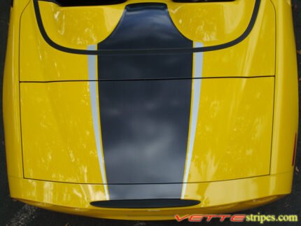 Yellow C6 Corvette convertible with black carbon fiber and silver ME stripe