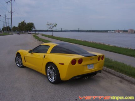 Yellow C6 Corvette coupe with black and silver ME stripe