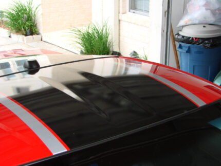 Red C6 Corvette with black and silver ME stripes