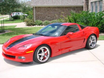 Red C6 Corvette with black and silver ME stripes