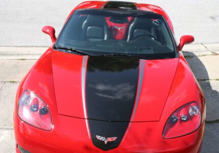 Red C6 Corvette with metallic black and gunmetal ME stripes