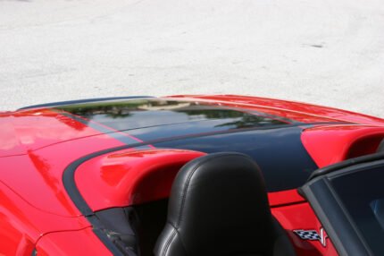 Red C6 Corvette with metallic black and gunmetal ME stripes