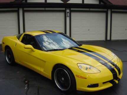 Yellow C6 Corvette with black racing stripe