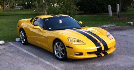 Yellow C6 Corvette with black racing stripe