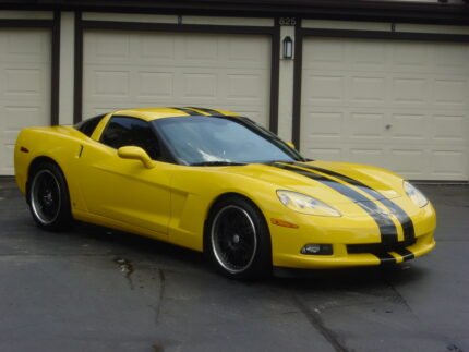 Yellow C6 Corvette with black racing stripe