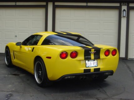 Yellow C6 Corvette with black racing stripe