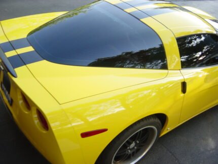 Yellow C6 Corvette with black racing stripe