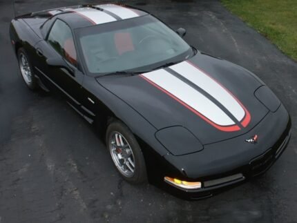 Black C5 Corvette with silver and red CE commemorative stripes