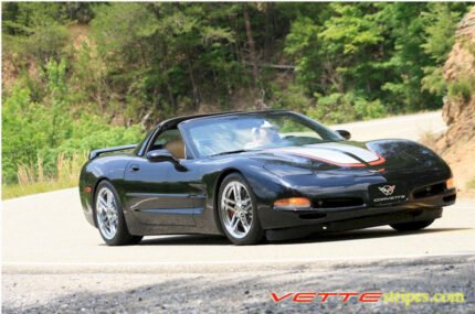 Black C5 Corvette with silver and red CE commemorative stripes