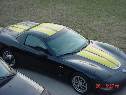 Black C5 Corvette with yellow and silver CE commemorative stripes