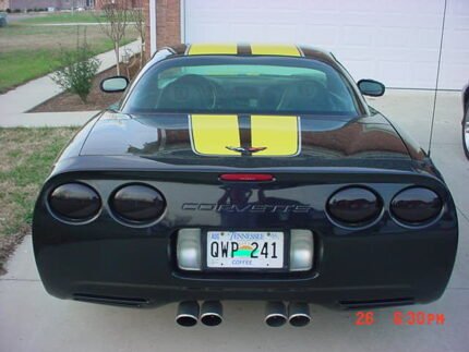 Black C5 Corvette with yellow and silver CE commemorative stripes