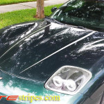 Fairway green C5 Corvette with silver hood spear stripe