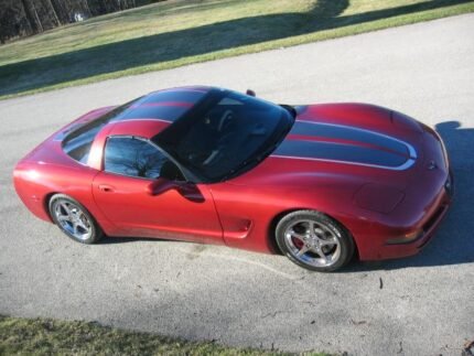 Magnetic red C5 Corvette with gunmetal and silver CE commemorative stripes