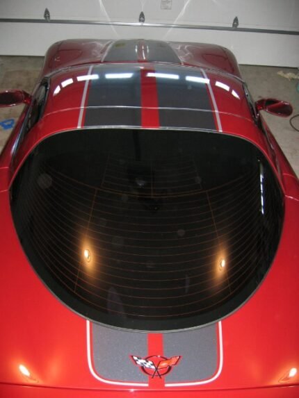 Magnetic red C5 Corvette with gunmetal and silver CE commemorative stripes