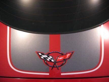 Magnetic red C5 Corvette with gunmetal and silver CE commemorative stripes