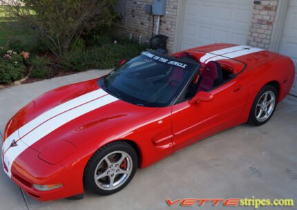 Red C5 Corvette convertible with white full body racing stripe style 3