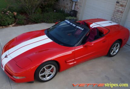 Red C5 Corvette convertible with white full body racing stripe style 3