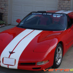 Red C5 Corvette convertible with white full body racing stripe style 3