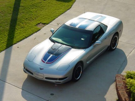 Silver C5 Corvette Z06 with grand blue and red MCM hood stripe