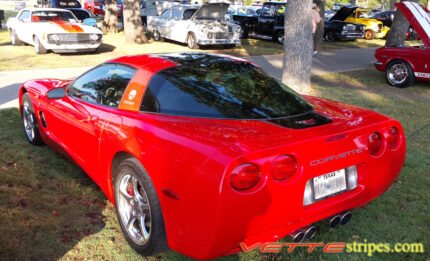 Torch red C5 Corvette with black and silver GT1 stripe and optional black carbon fiber jake skull insert