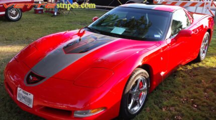 Torch red C5 Corvette with black and silver GT1 stripe and optional black carbon fiber jake skull insert