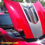 Torch red C5 Corvette with black and silver GT1 stripe and optional black carbon fiber jake skull insert