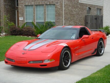 Torch red C5 Corvette with silver and black CE commemorative stripes