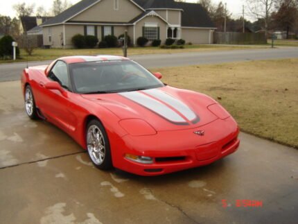 Torch red C5 Corvette with silver and black CE commemorative stripes