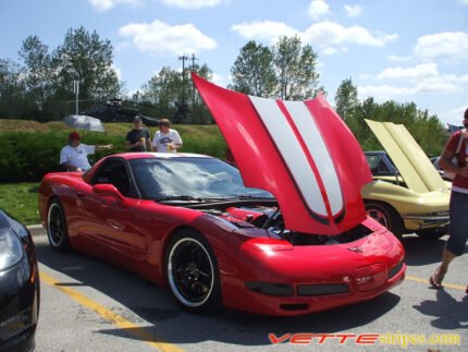 Torch red C5 Corvette with silver and black CE commemorative stripes