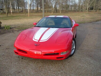 Torch red C5 Corvette with white CE commemorative stripes