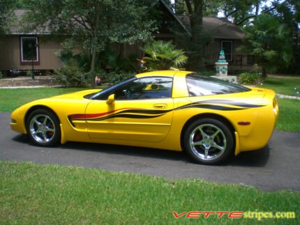 Yellow C5 Corvette with black and red side stripe graphic