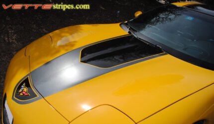 Yellow C5 Corvette with black and dark charcoal GT1 stripe