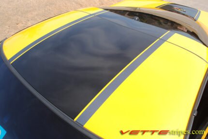 Yellow C5 Corvette with black and gunmetal GT1 stripe