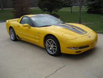 Yellow C5 Corvette with metallic black MCM hood style 2 stripe