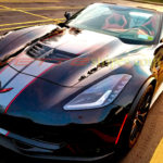 Black C7 Z06 convertible with dark charcoal red GM full length dual racing stripe 2 and optional jake cutout