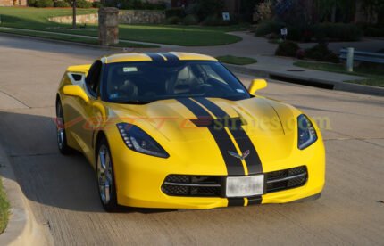 Yellow C7 Corvette stingray with matte black racing 3 stripes