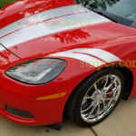 Red C6 Corvette convertible with metallic silver grand sport fender hash marks stripes