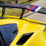 Yellow C7 Corvette ZR1 spoiler stripes in silver blue red