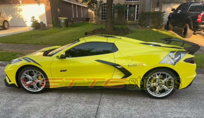 Accelerate yellow C8 Corvette with front and rear Stingray R fender hash marks