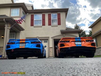 Amplified orange and rapid blue C8 Corvette with full length dual racing stripes